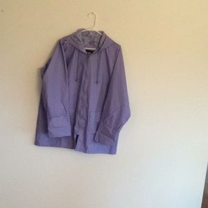 Totes purple vinyl rain coat with hood & pockets.